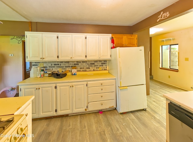 464 E Lincoln, Priest River, ID 83856 - kitchen featuring freestanding refrigerator, stainless steel dishwasher, white cabinets, light countertops, and light wood-style floors