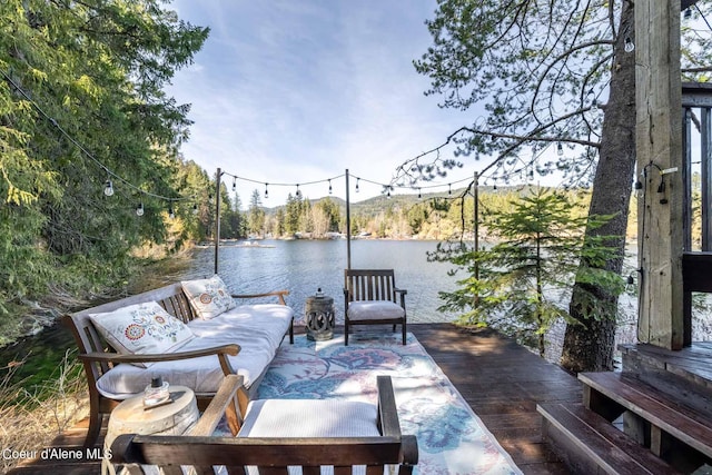 7771 W Channel Ln, Rathdrum, ID 83858 - view of patio with a water view and a view of trees