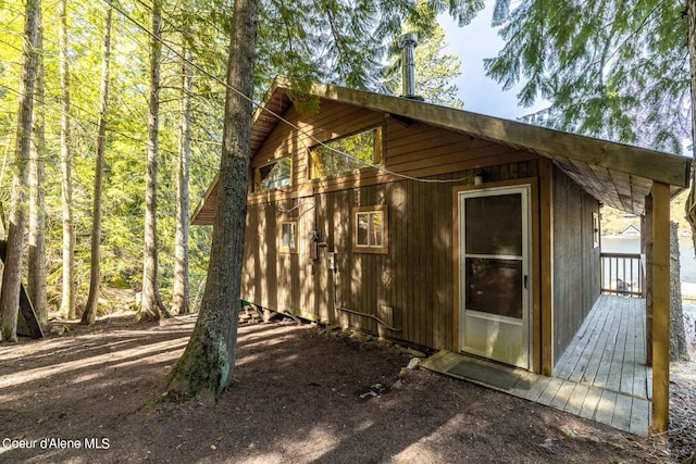 7771 W Channel Ln, Rathdrum, ID 83858 - view of side of home featuring a deck