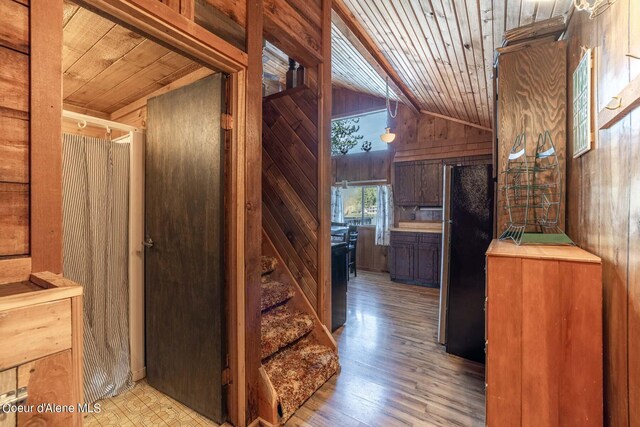 7771 W Channel Ln, Rathdrum, ID 83858 - hall with wooden ceiling, wood walls, light wood-style floors, and vaulted ceiling