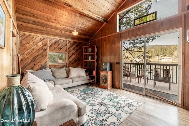 7771 W Channel Ln, Rathdrum, ID 83858 - living area with wooden ceiling, vaulted ceiling, wood walls, and wood finished floors