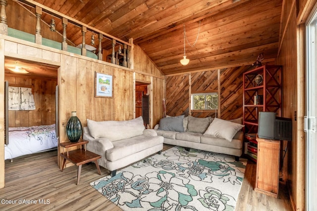 7771 W Channel Ln, Rathdrum, ID 83858 - living area with wood walls, wood ceiling, lofted ceiling, and wood finished floors