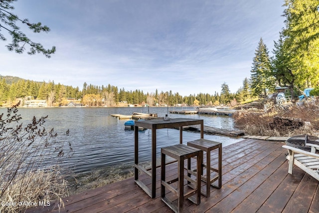 7771 W Channel Ln, Rathdrum, ID 83858 - dock area featuring a water view and a wooded view