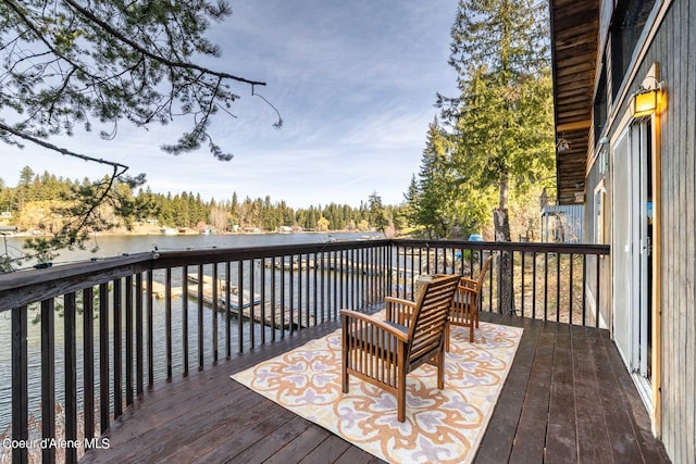 7771 W Channel Ln, Rathdrum, ID 83858 - wooden terrace with a water view