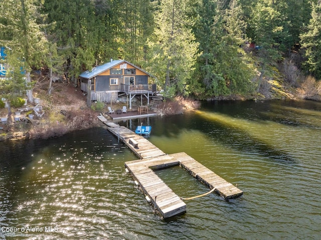 7771 W Channel Ln, Rathdrum, ID 83858 - dock featuring a view of trees and a deck with water view