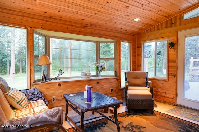 7672 W Carnie Rd, Coeur Dalene, ID 83814 - sunroom / solarium featuring vaulted ceiling and wood walls