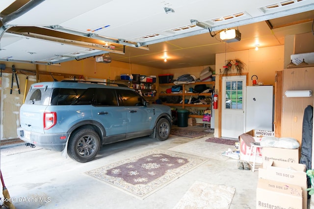 7672 W Carnie Rd, Coeur Dalene, ID 83814 - garage featuring a garage door opener