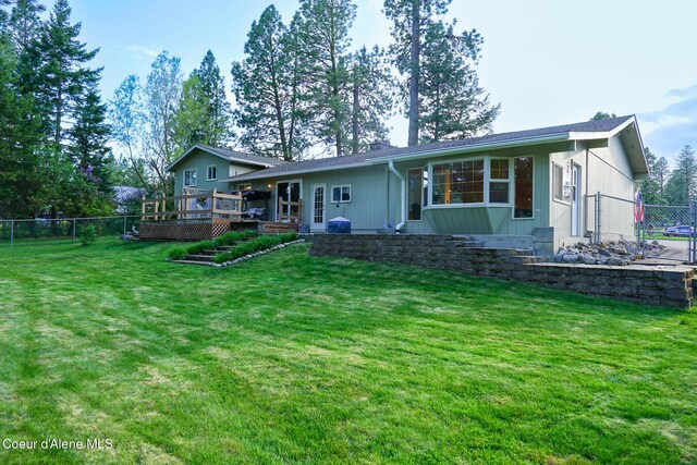 7672 W Carnie Rd, Coeur Dalene, ID 83814 - rear view of house featuring a deck