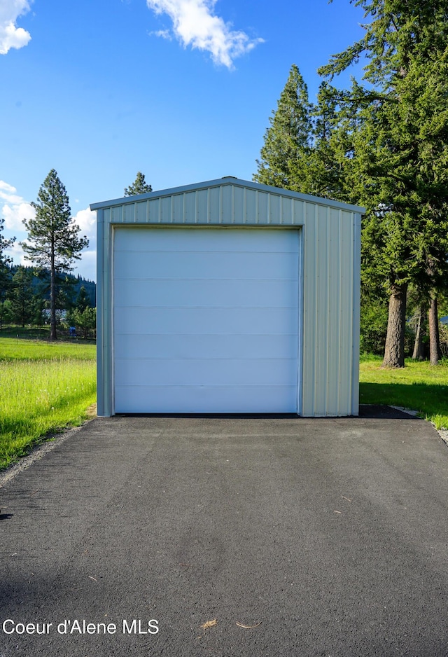 7672 W Carnie Rd, Coeur Dalene, ID 83814 - detached garage with asphalt driveway