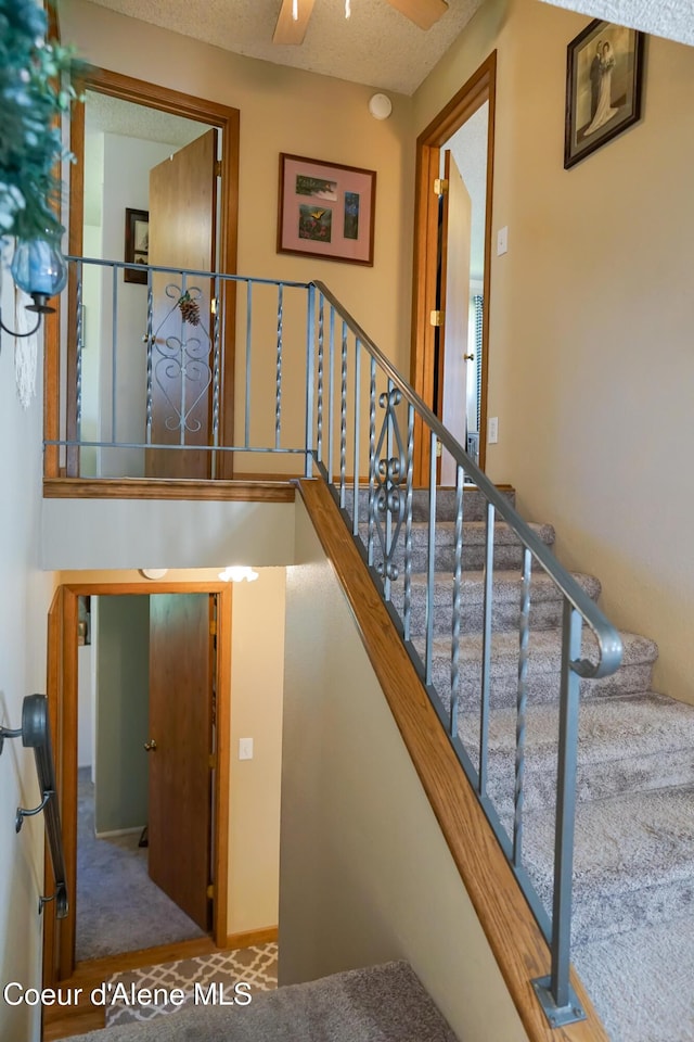 7672 W Carnie Rd, Coeur Dalene, ID 83814 - stairs with carpet floors and ceiling fan