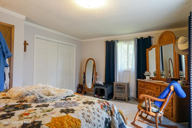 7672 W Carnie Rd, Coeur Dalene, ID 83814 - bedroom with ornamental molding, a textured ceiling, a closet, carpet, and a wood stove