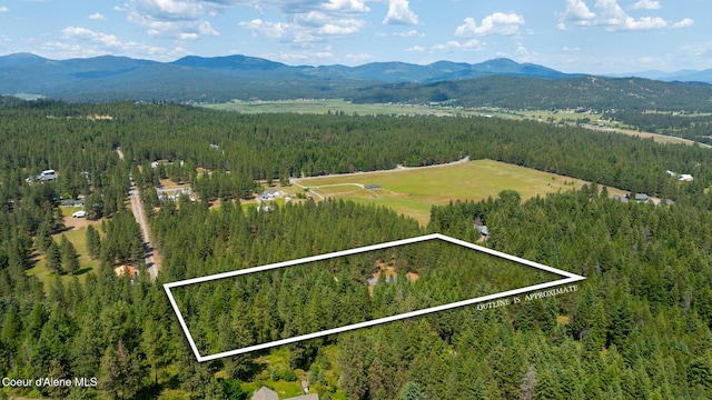 23216 E Morris Rd, Newman Lake, WA 99025 - view of property location featuring a forest, a mountainous background, and property boundaries highlighted