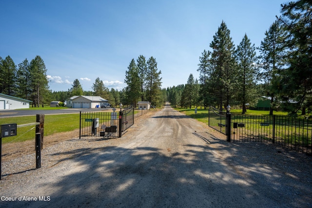 23216 E Morris Rd, Newman Lake, WA 99025 - view of dirt / gravel driveway featuring a gated entry