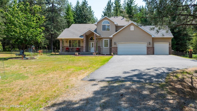 23216 E Morris Rd, Newman Lake, WA 99025 - traditional-style house with asphalt driveway, a front yard, a garage, a porch, and brick siding