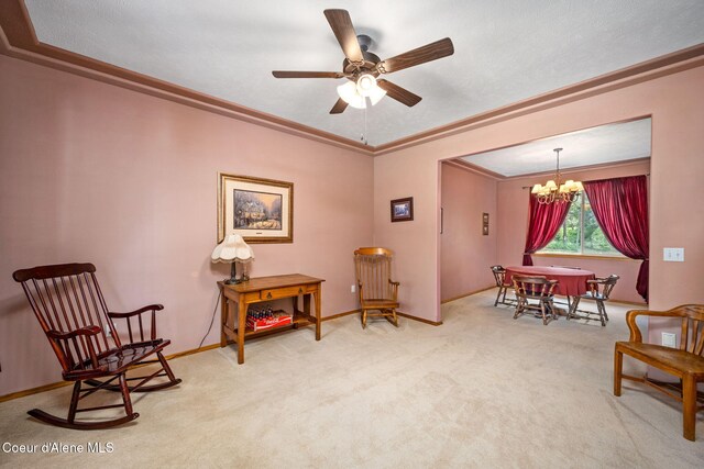 23216 E Morris Rd, Newman Lake, WA 99025 - sitting room with carpet floors, a chandelier, a ceiling fan, ornamental molding, and baseboards