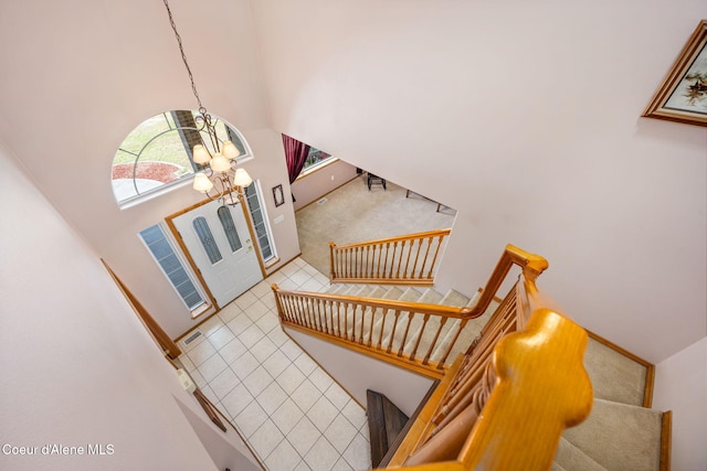 23216 E Morris Rd, Newman Lake, WA 99025 - entrance foyer featuring a chandelier, stairway, plenty of natural light, and high vaulted ceiling
