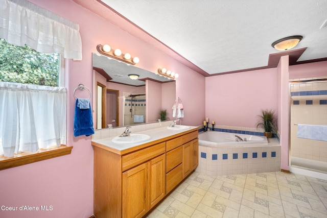23216 E Morris Rd, Newman Lake, WA 99025 - full bath featuring a tile shower, double vanity, a garden tub, and a textured ceiling