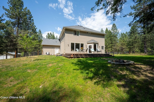 23216 E Morris Rd, Newman Lake, WA 99025 - rear view of property featuring an outdoor fire pit, a wooden deck, and a yard