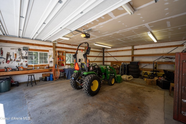 23216 E Morris Rd, Newman Lake, WA 99025 - garage with a garage door opener and a workshop area