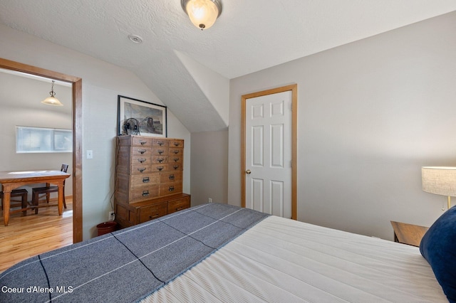 927 E Birch Ave, Coeur Dalene, ID 83814 - bedroom with wood finished floors and lofted ceiling