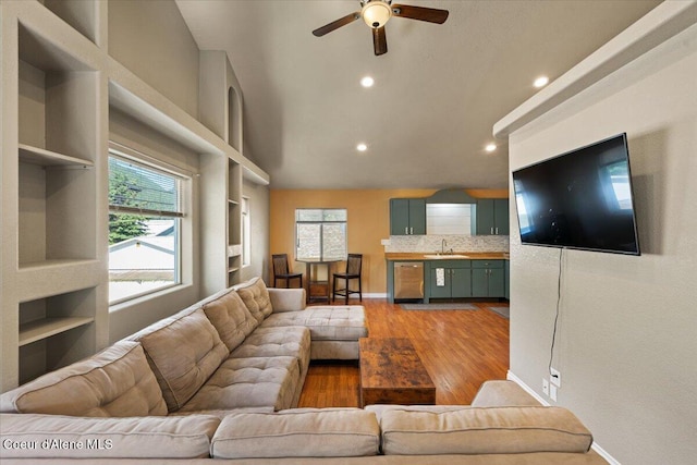 115 Fifth St, Osburn, ID 83849 - living area featuring a ceiling fan, recessed lighting, wood finished floors, built in shelves, and baseboards
