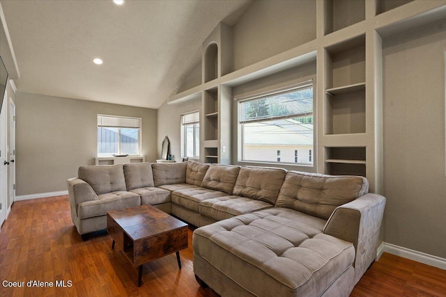 115 Fifth St, Osburn, ID 83849 - living area featuring built in features, baseboards, wood finished floors, recessed lighting, and high vaulted ceiling