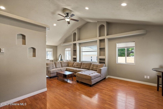 115 Fifth St, Osburn, ID 83849 - living area with vaulted ceiling, a ceiling fan, baseboards, wood finished floors, and recessed lighting