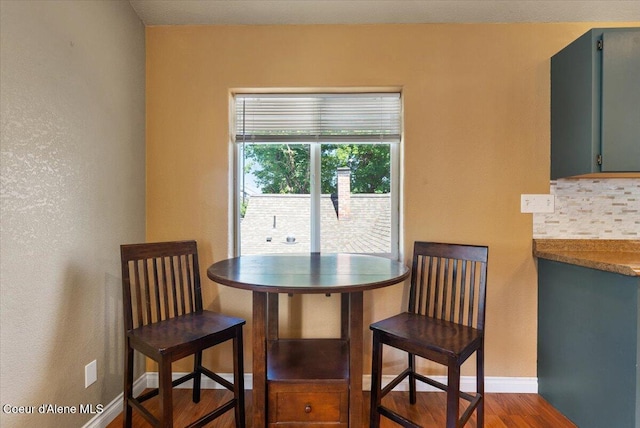 115 Fifth St, Osburn, ID 83849 - dining room with baseboards and dark wood-type flooring