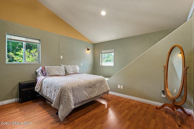 115 Fifth St, Osburn, ID 83849 - bedroom with vaulted ceiling, wood finished floors, and baseboards