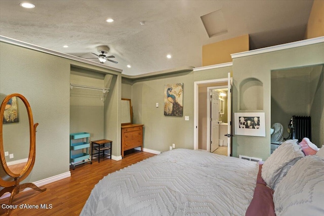 115 Fifth St, Osburn, ID 83849 - bedroom with recessed lighting, wood finished floors, attic access, baseboards, and a closet