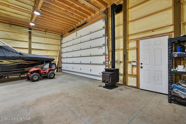 115 Fifth St, Osburn, ID 83849 - garage with a wood stove