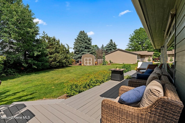 67 Spur Dr, Sandpoint, ID 83864 - deck featuring a shed, a yard, and an outdoor living space