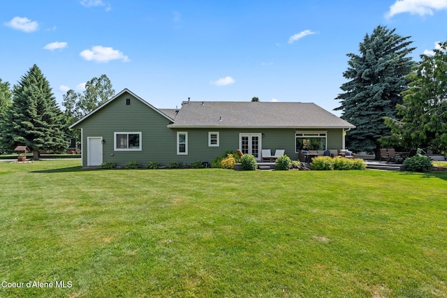 67 Spur Dr, Sandpoint, ID 83864 - rear view of house featuring a yard, french doors, a patio, and an outdoor hangout area