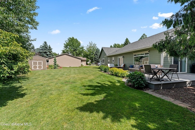 67 Spur Dr, Sandpoint, ID 83864 - view of green lawn featuring a storage shed and an outdoor living space