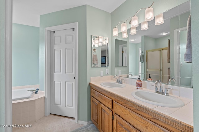 67 Spur Dr, Sandpoint, ID 83864 - bathroom featuring tile patterned floors, double vanity, a garden tub, and a stall shower
