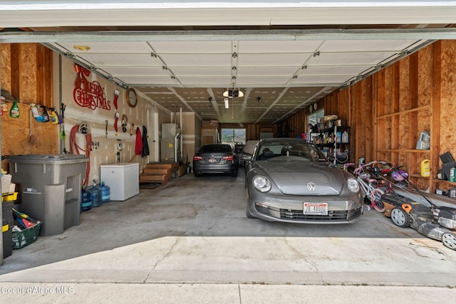 67 Spur Dr, Sandpoint, ID 83864 - garage with a garage door opener and refrigerator