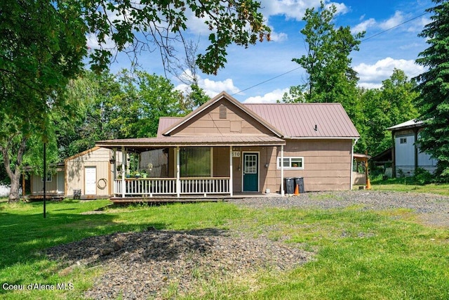 510 S 2nd St, Saint Maries, ID 83861 - view of front of home featuring a porch, a front yard, and a metal roof