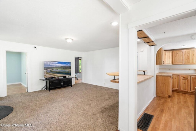 510 S 2nd St, Saint Maries, ID 83861 - living area with arched walkways and light carpet