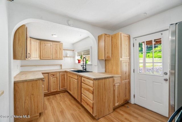 510 S 2nd St, Saint Maries, ID 83861 - kitchen featuring light brown cabinetry, light wood-type flooring, and healthy amount of natural light