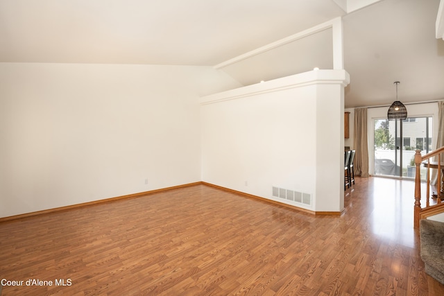 2867 W Tours Dr, Coeur Dalene, ID 83815 - empty room with lofted ceiling and wood finished floors