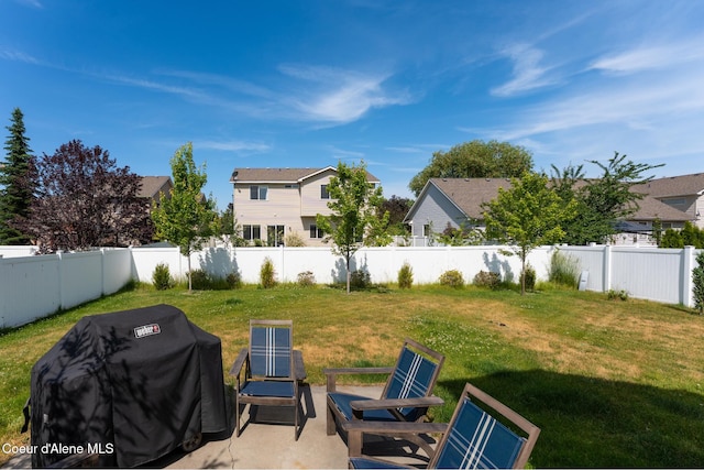 2867 W Tours Dr, Coeur Dalene, ID 83815 - fenced backyard with a patio area and a residential view