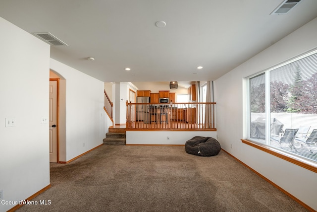2867 W Tours Dr, Coeur Dalene, ID 83815 - spare room featuring healthy amount of natural light, carpet, stairs, and recessed lighting