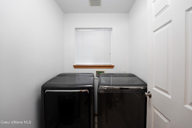 2867 W Tours Dr, Coeur Dalene, ID 83815 - laundry room featuring washer and dryer