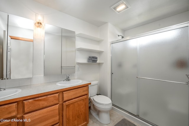 2867 W Tours Dr, Coeur Dalene, ID 83815 - bathroom with double vanity, a shower stall, and tile patterned floors