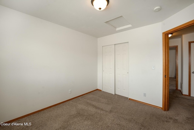2867 W Tours Dr, Coeur Dalene, ID 83815 - unfurnished bedroom with attic access, carpet floors, and a closet