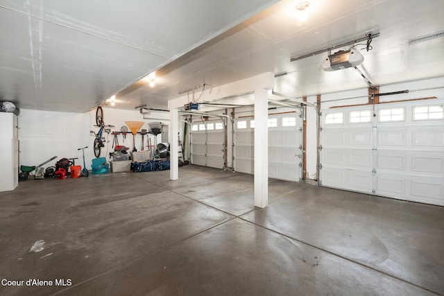 2867 W Tours Dr, Coeur Dalene, ID 83815 - garage with a garage door opener