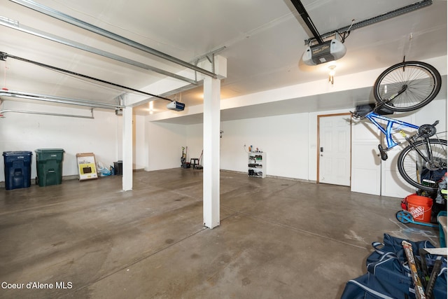 2867 W Tours Dr, Coeur Dalene, ID 83815 - garage with a garage door opener