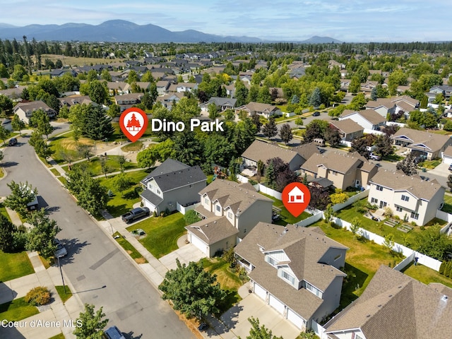 2867 W Tours Dr, Coeur Dalene, ID 83815 - aerial view of residential area featuring a mountain backdrop