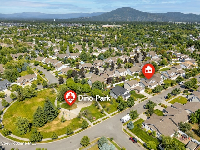 2867 W Tours Dr, Coeur Dalene, ID 83815 - aerial perspective of suburban area with a mountain backdrop