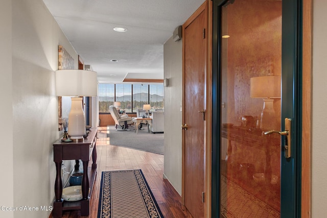 3574 E Tobler Rd # C16, Hayden, ID 83835 - corridor featuring wood finished floors, expansive windows, and recessed lighting